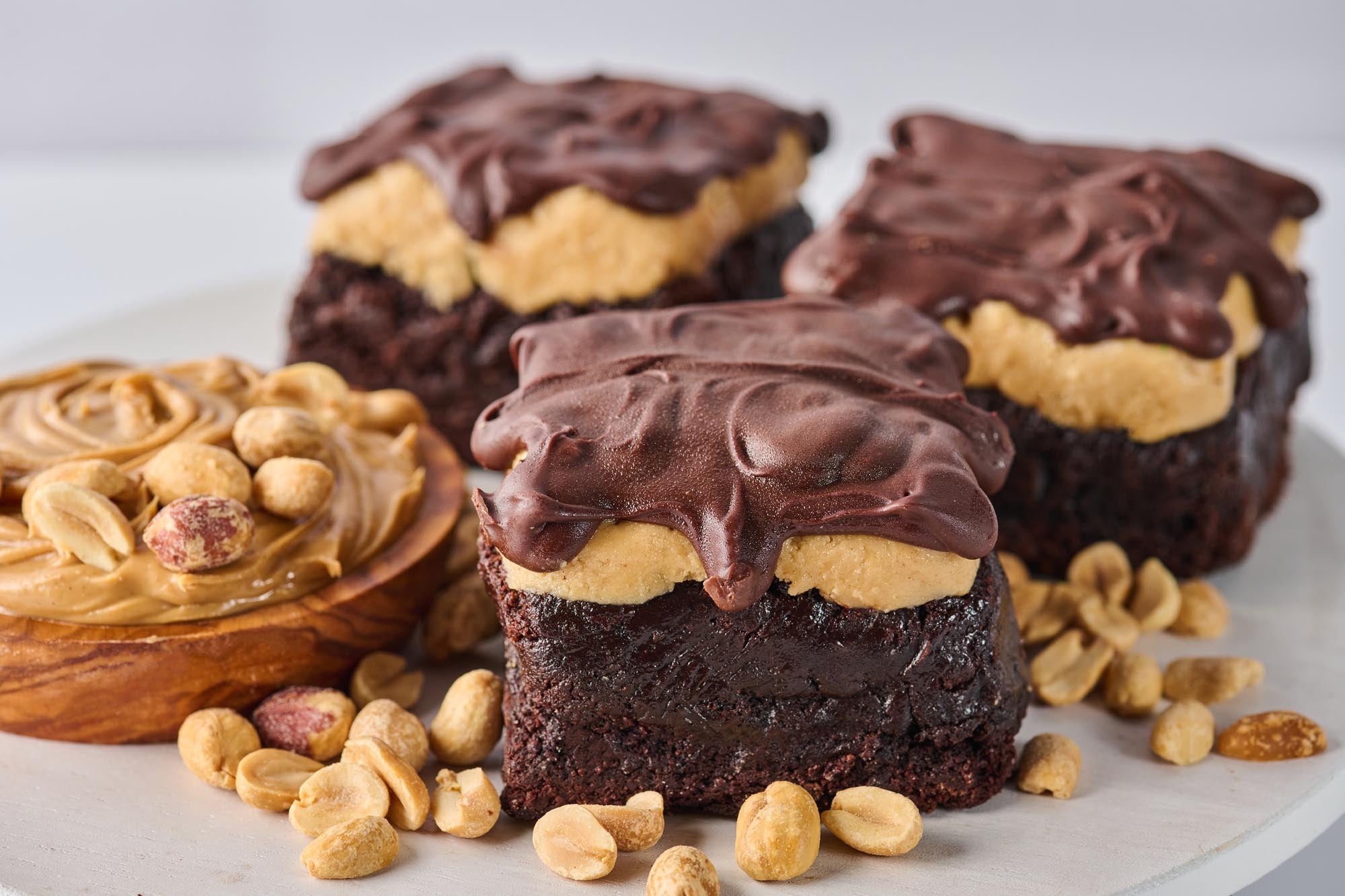 The Bucky Brownie with fudgy chocolate base, creamy peanut butter center, melted chocolate topping, and a sprinkle of sea salt