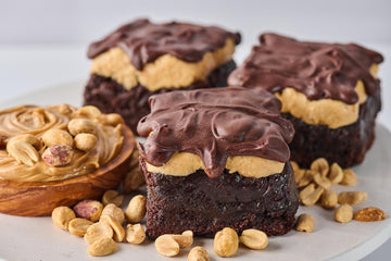 The Bucky Brownie with fudgy chocolate base, creamy peanut butter center, melted chocolate topping, and a sprinkle of sea salt