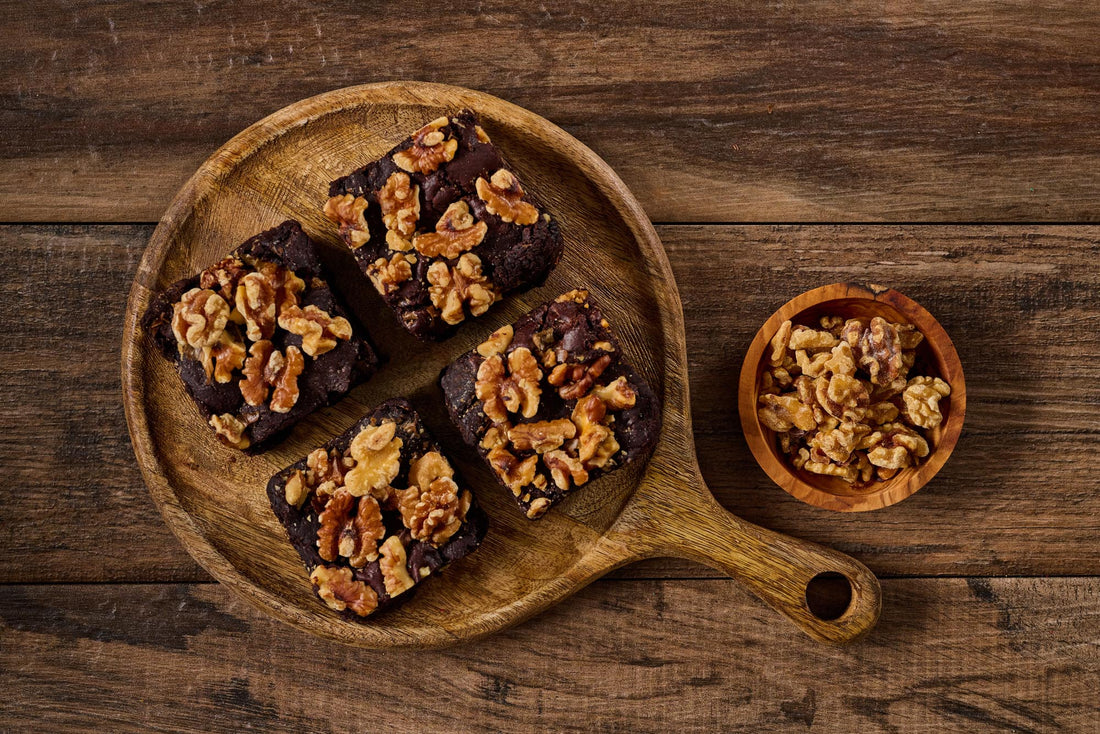 The Choconutty Brownie with fudgy chocolate base, walnut chunks, and topped with walnuts for a rich, nutty flavor