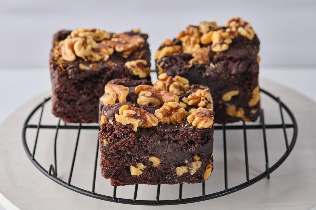 The Choconutty Brownie with fudgy chocolate base, walnut chunks, and topped with walnuts for a rich, nutty flavor