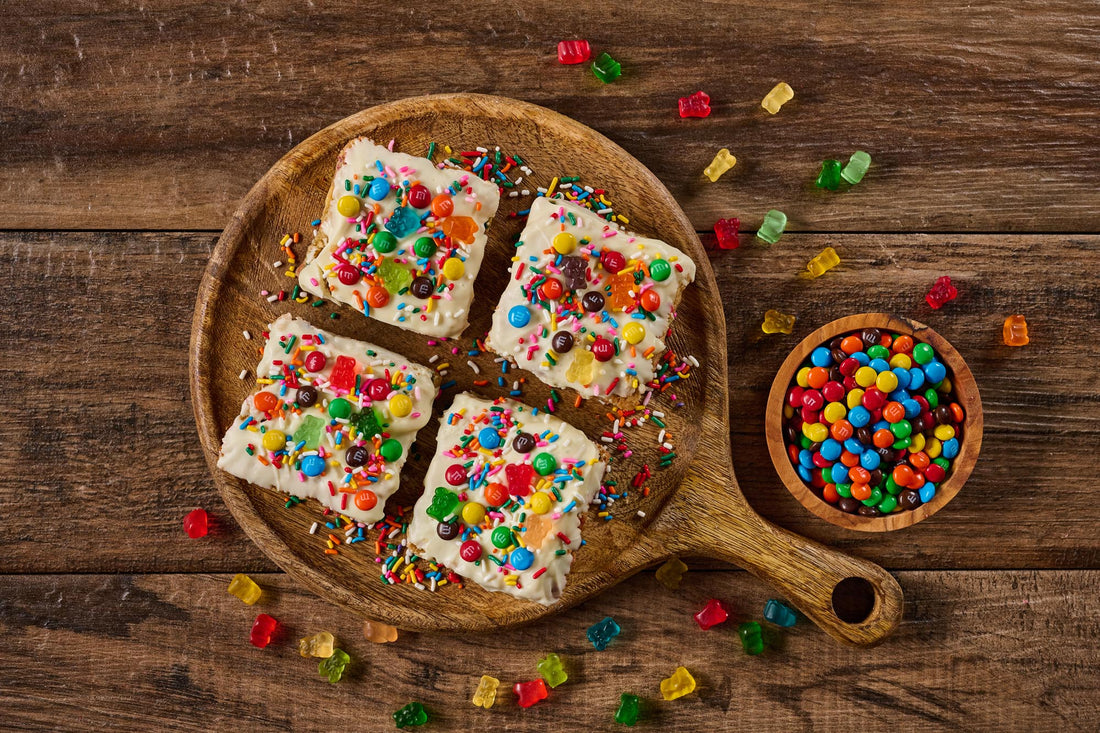 Jubilee Brownie with cake-like base, colorful rainbow sprinkles, gummy bears, and mini M&M's topping