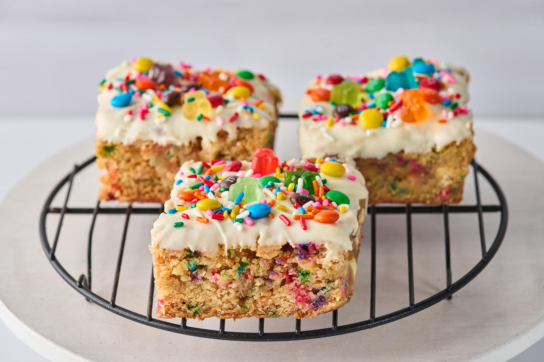 Jubilee Brownie with cake-like base, colorful rainbow sprinkles, gummy bears, and mini M&M's topping