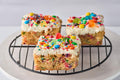 Jubilee Brownie with cake-like base, colorful rainbow sprinkles, gummy bears, and mini M&M's topping