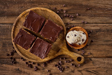 Millidough Million Dollar Cookie Dough Brownie with fudgy brownie base, caramel, homemade cookie dough, chocolate chips, and melted chocolate topping
