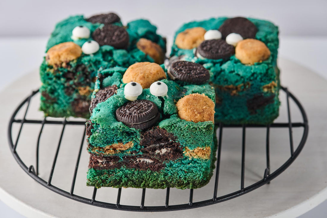 Cookie Monster Blondie with soft buttery base, chunky cookie pieces, crumbled chocolate chip cookies, and topped with Chips Ahoy, Oreo cookies, and candy eyeballs for a fun, indulgent treat